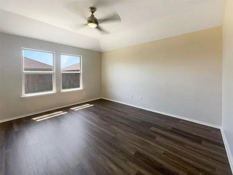 1809 Meadow Crest Drive Princeton, TX 75407 - Photo 17 of 20 wooden floor in an empty room with a window
