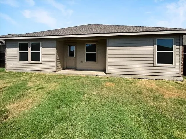 a house view with a backyard space