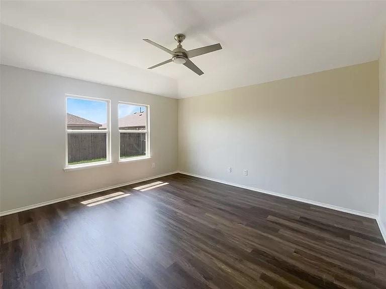 1809 Meadow Crest Drive Princeton, TX 75407 - Photo 2 of 20 a view of an empty room with wooden floor and a window