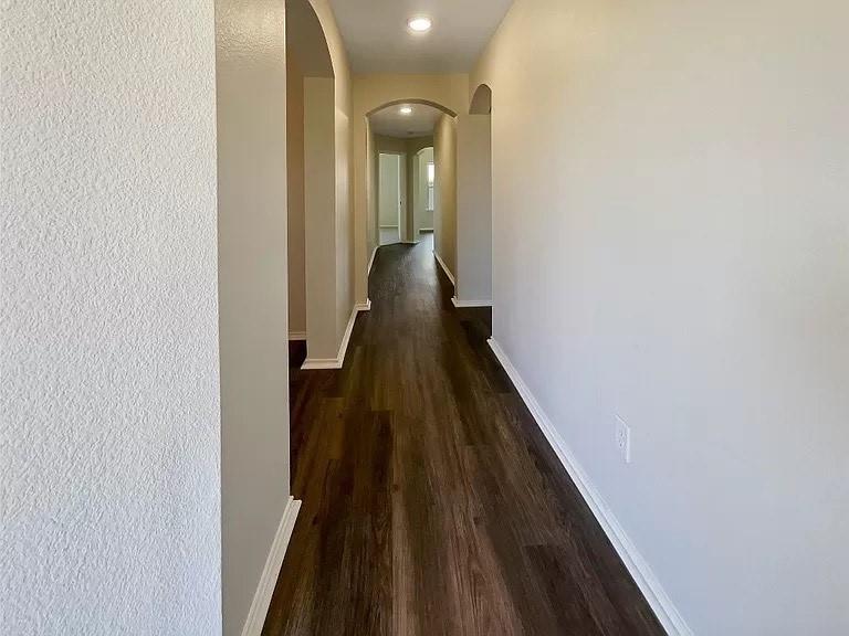 1809 Meadow Crest Drive Princeton, TX 75407 - Photo 5 of 20 a view of a hallway with wooden floor and staircase