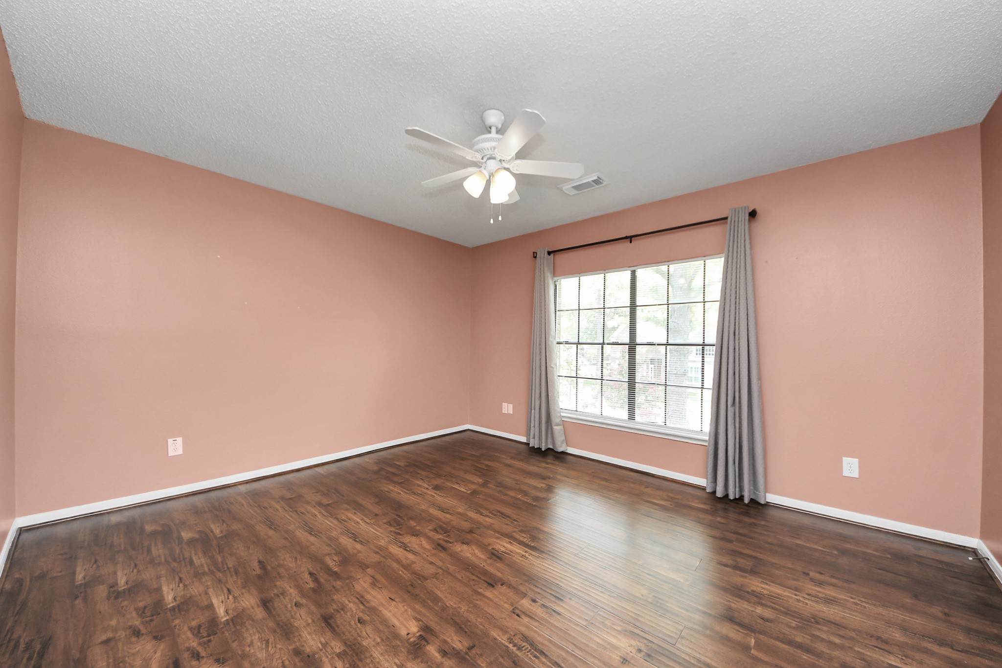 3107 Dulaney Road Houston, TX 77084 - Photo 41 of 50 wooden floor in an empty room with a window