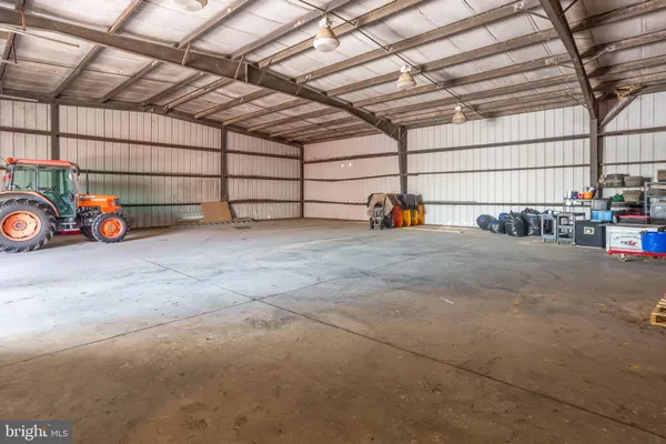 a view of a garage with parked cars