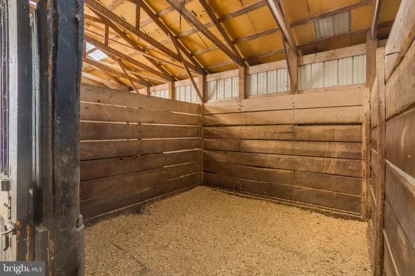 a view of a room with wooden walls