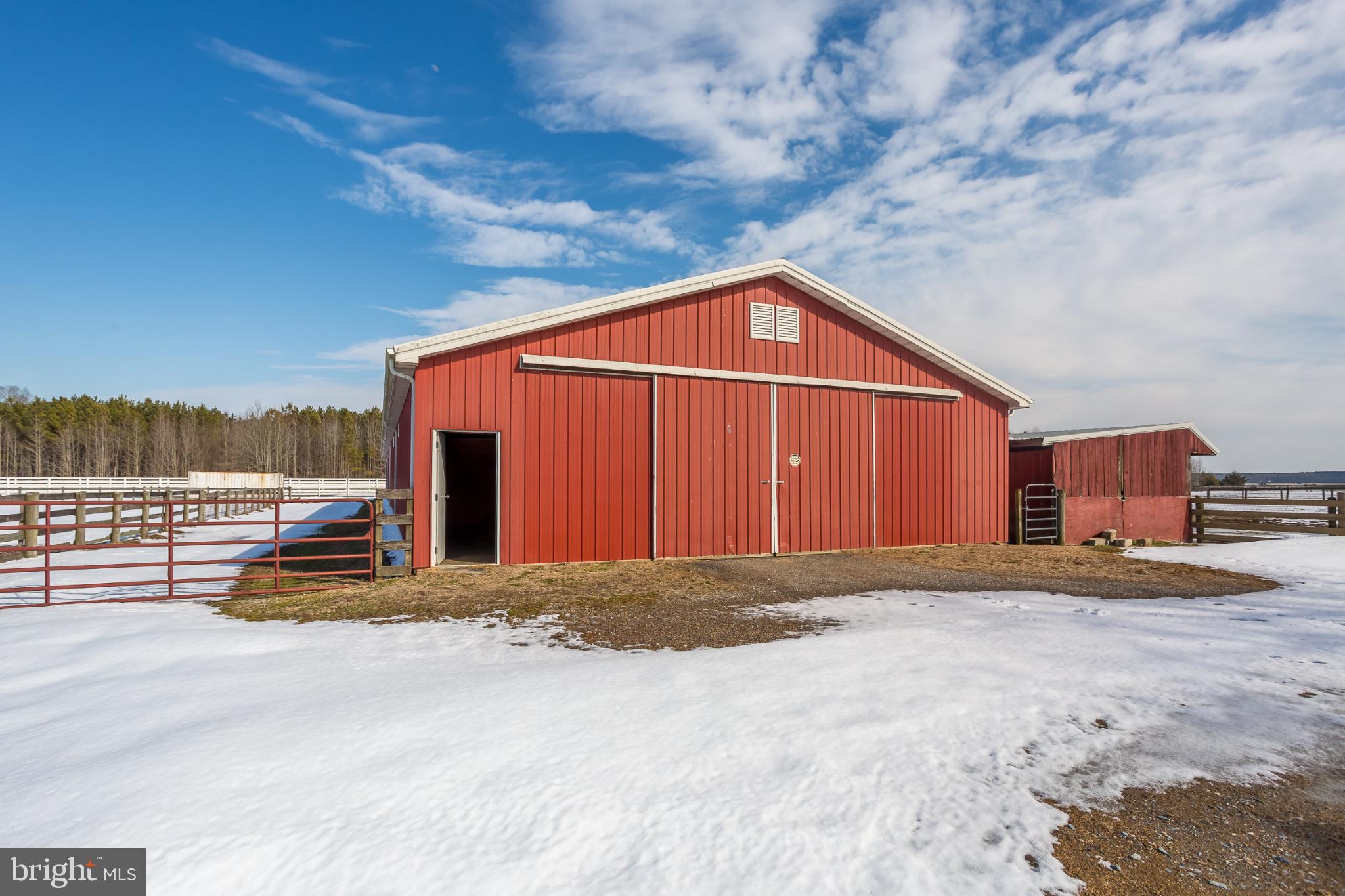 3985 White Road Federalsburg, MD 21632 - Photo 34 of 52 Charming red barn under a bright blue sky.