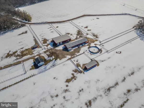 an aerial view of a house with swimming pool