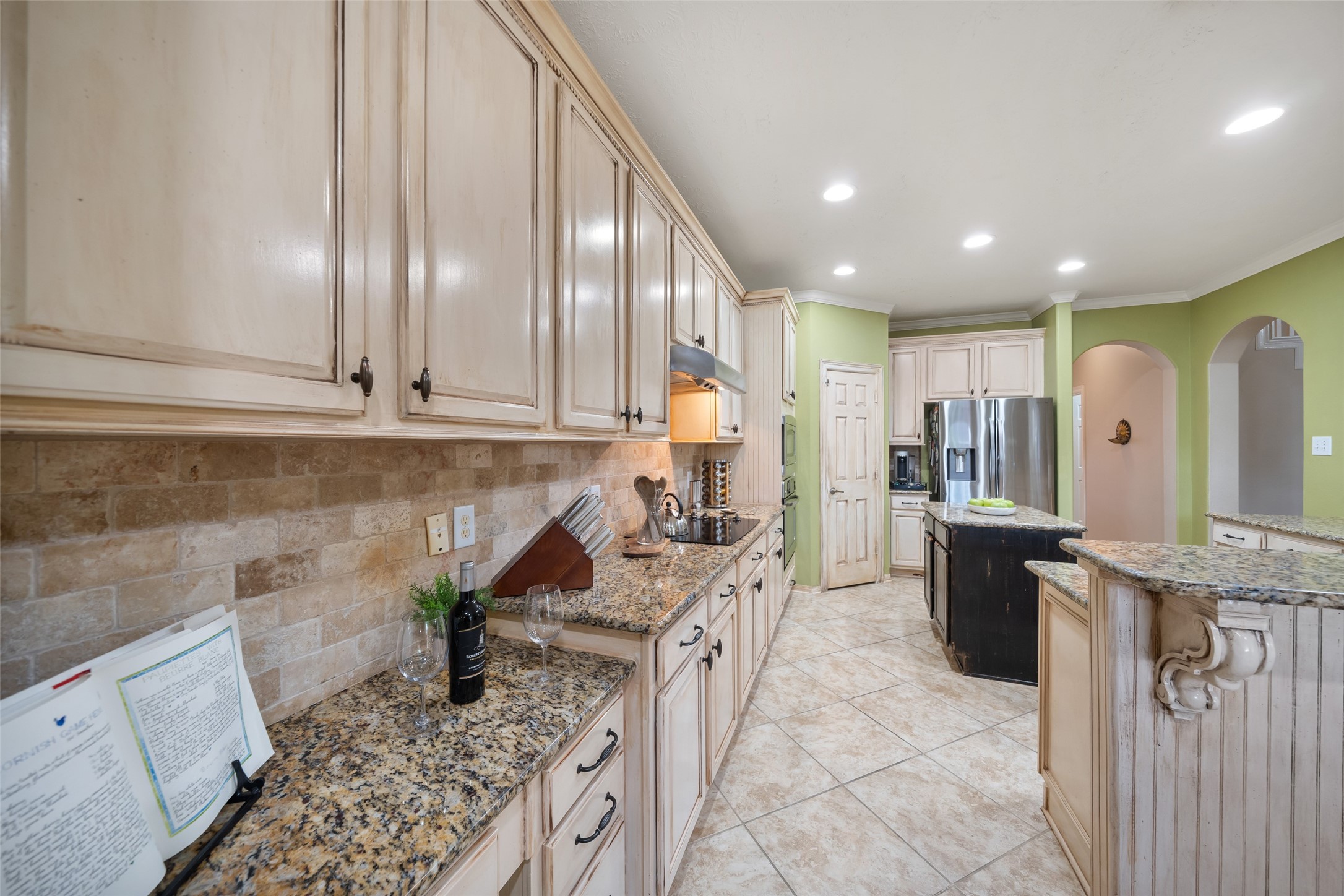 6407 Ashley Manor Drive Spring, TX 77389 - Photo 14 of 41 a kitchen with stainless steel appliances kitchen island granite countertop a sink and cabinets