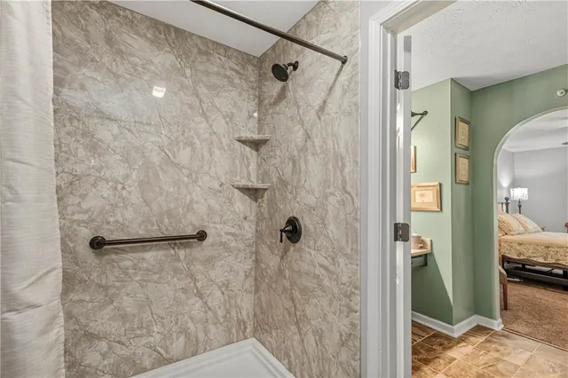 a bathroom with a shower and a tub