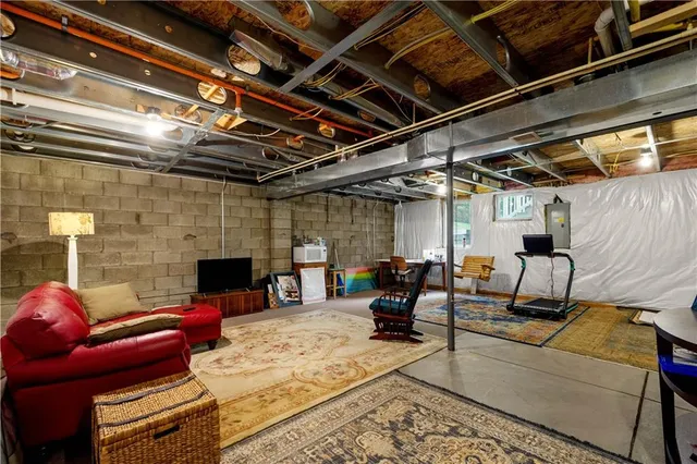a view of livingroom with couch and chairs