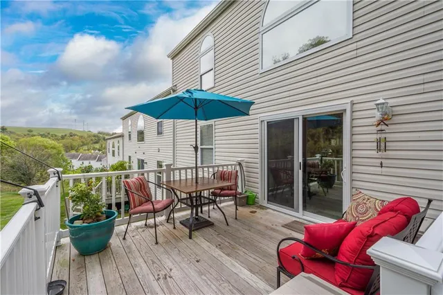 a view of balcony with outdoor seating and wooden floor