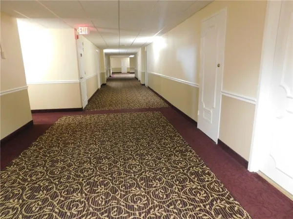 a view of a balcony with two chairs and a table