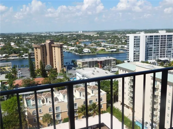 a balcony view with couple of chairs