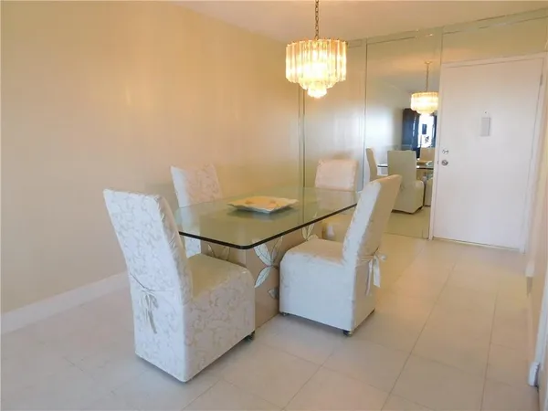 a living room with furniture and a lamp