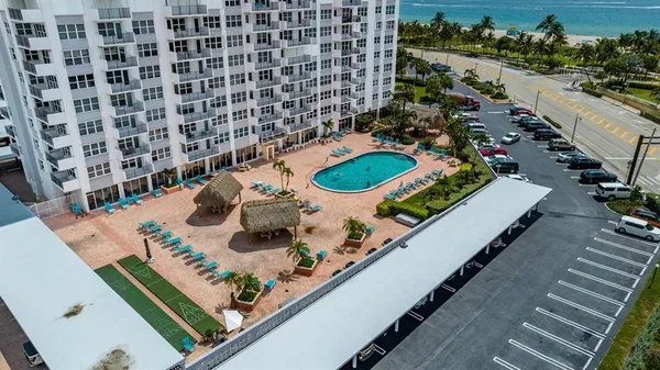 a terrace with outdoor seating and city view