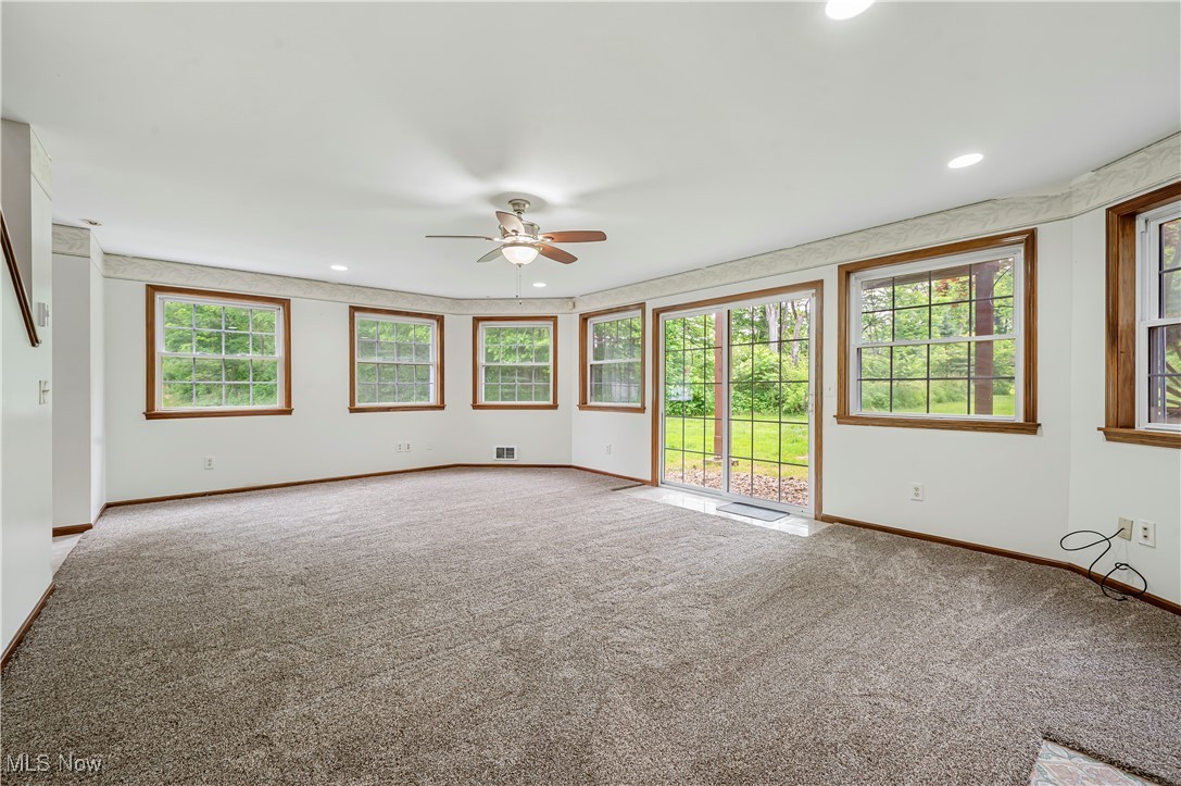 12358 Harmon Road New Springfield, OH 44443 - Photo 12 of 44 Unfurnished living room with carpet flooring, ceiling fan, and recessed lighting