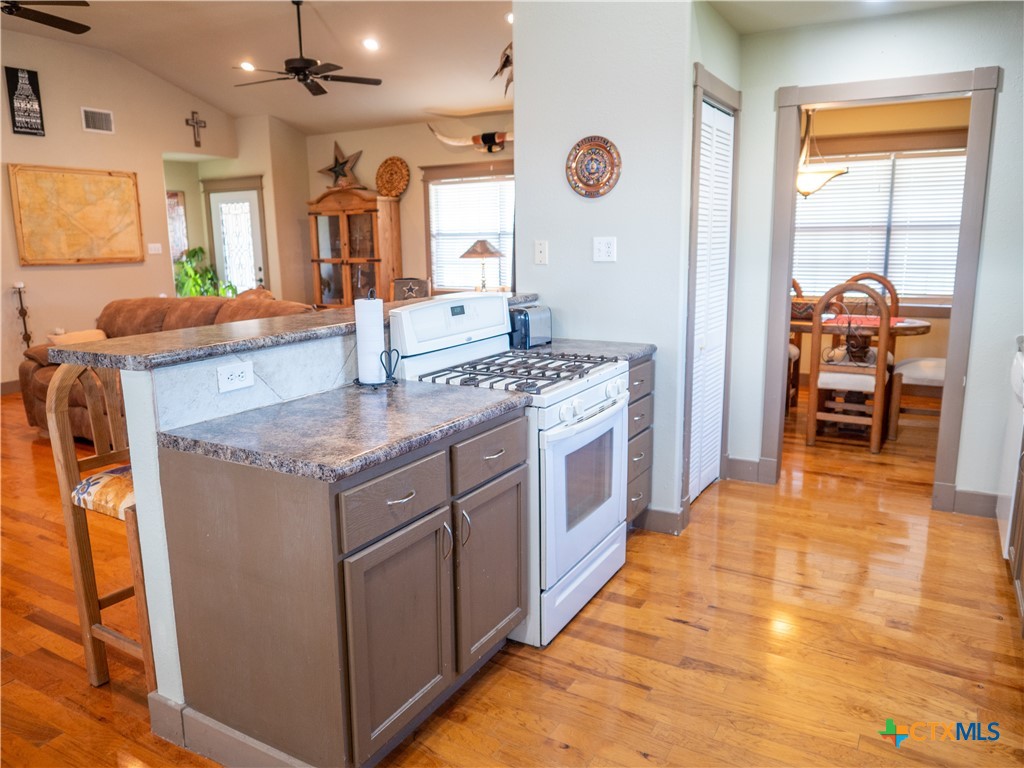 1704 Jackson Street Port Lavaca, TX 77979 - Photo 17 of 40 a kitchen with stainless steel appliances granite countertop a stove and a sink