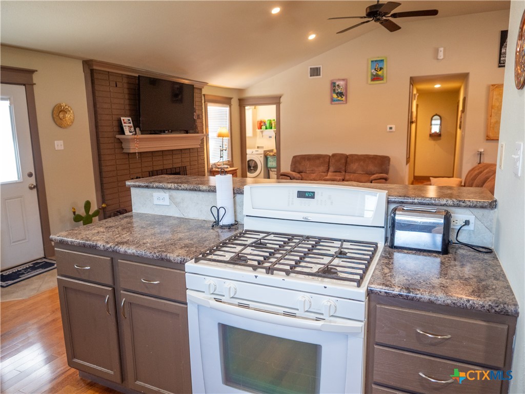 1704 Jackson Street Port Lavaca, TX 77979 - Photo 18 of 40 a kitchen with granite countertop cabinets stainless steel appliances and a counter space