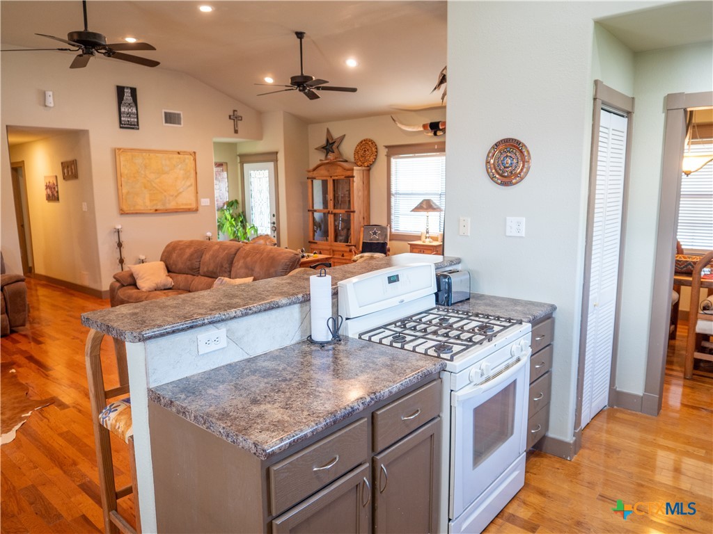1704 Jackson Street Port Lavaca, TX 77979 - Photo 19 of 40 a kitchen with a sink stove and cabinets