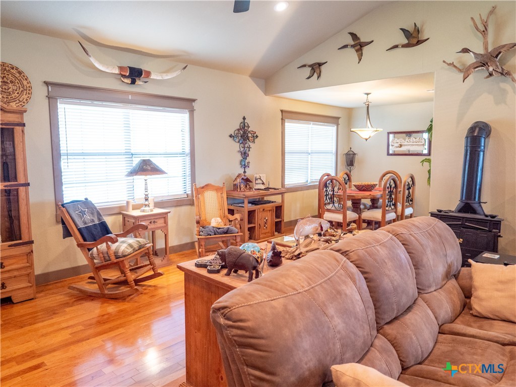 1704 Jackson Street Port Lavaca, TX 77979 - Photo 22 of 40 a large bedroom with two beds and large windows