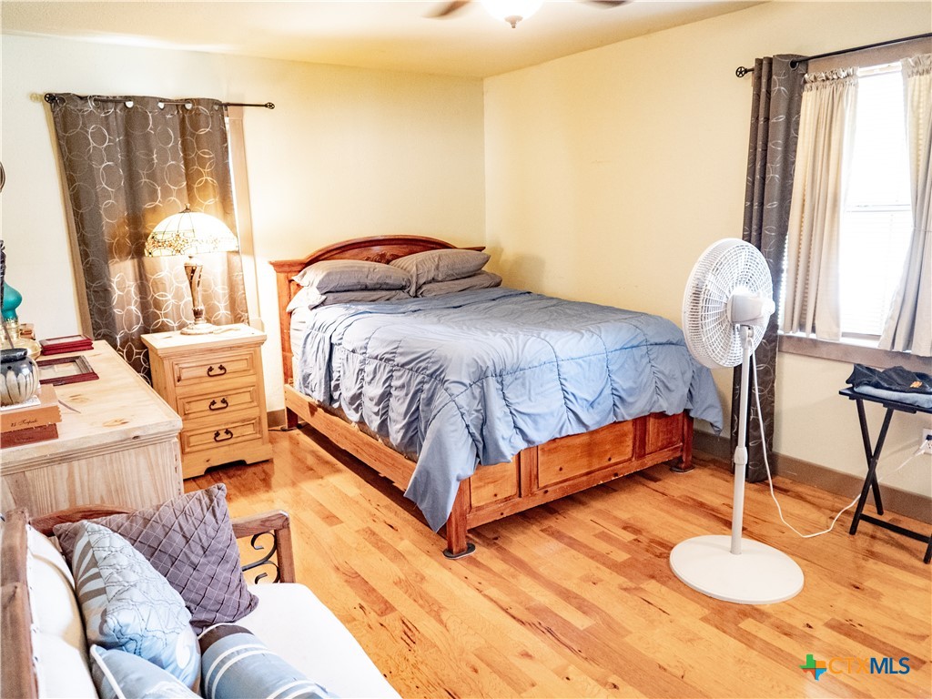 1704 Jackson Street Port Lavaca, TX 77979 - Photo 27 of 40 a spacious bedroom with a bed and window