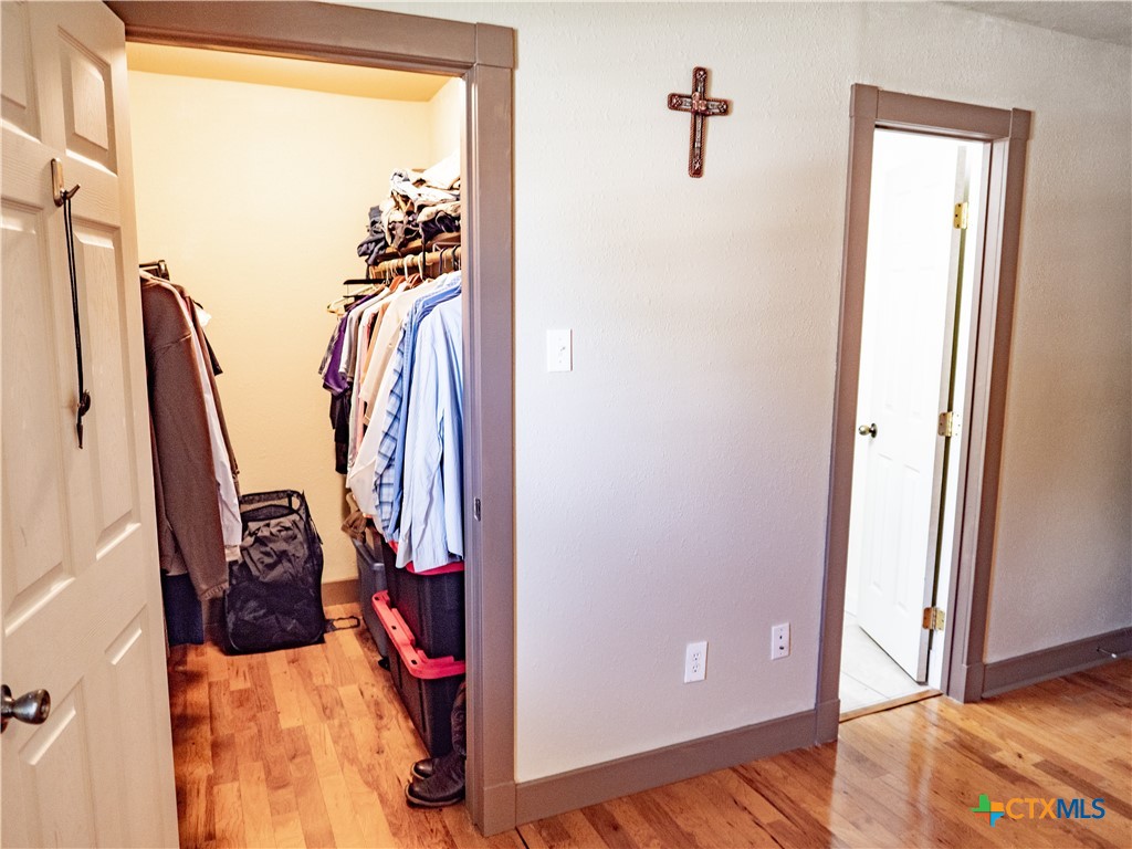 1704 Jackson Street Port Lavaca, TX 77979 - Photo 29 of 40 a view of walk in closet with clothes and shoes