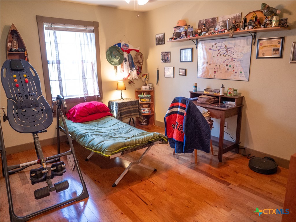 1704 Jackson Street Port Lavaca, TX 77979 - Photo 34 of 40 a bed sitting in a bedroom next to a window