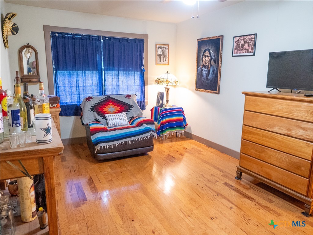 1704 Jackson Street Port Lavaca, TX 77979 - Photo 36 of 40 a bedroom with furniture and a flat screen tv