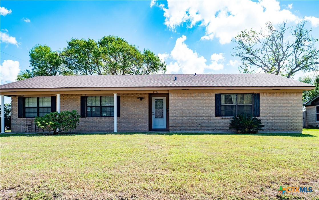 1704 Jackson Street Port Lavaca, TX 77979 - Photo 6 of 40 a front view of a house with a yard