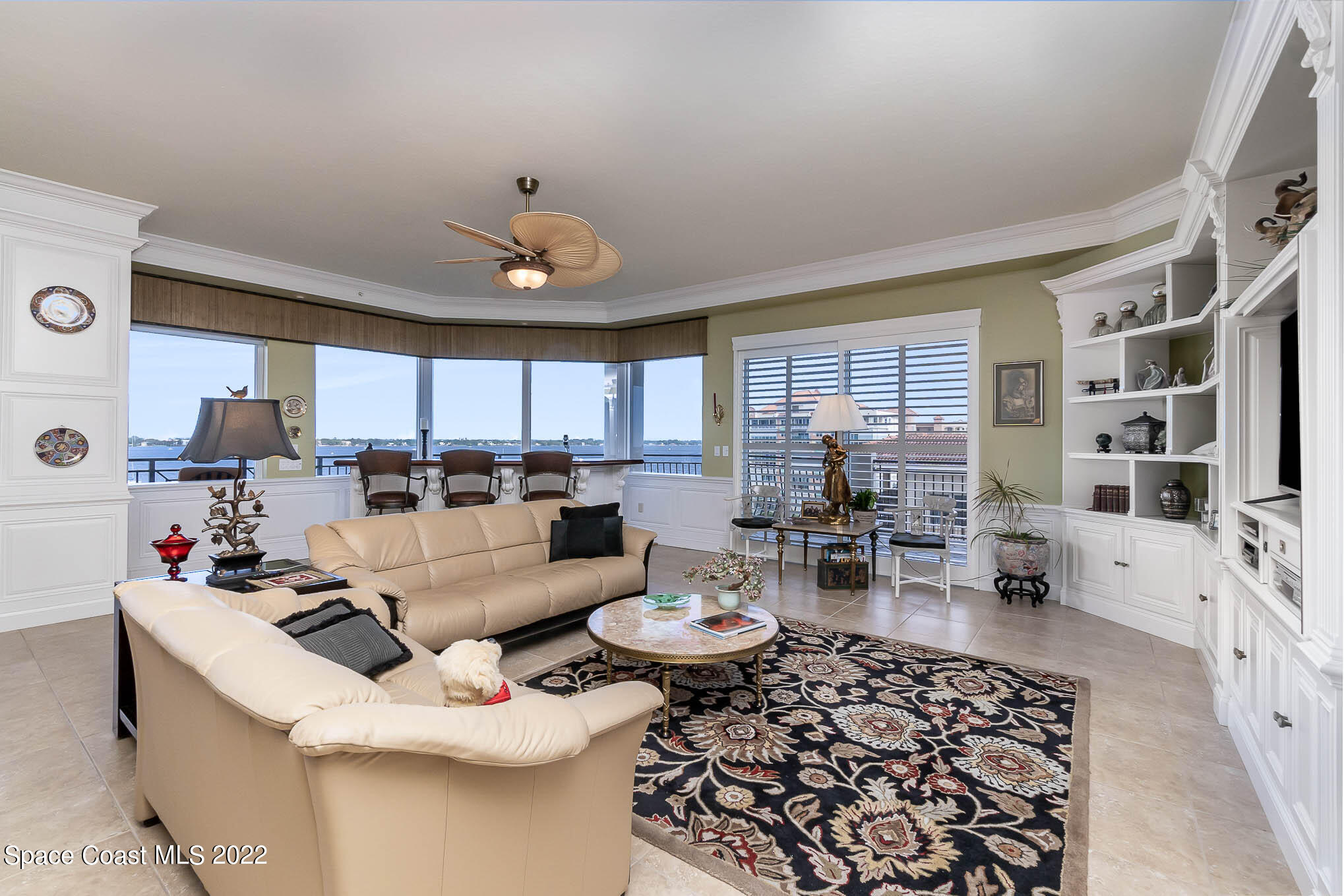 21 Riverside Drive, Unit 702 Cocoa, FL 32922 - Photo 11 of 53 a living room with furniture fireplace and a large window