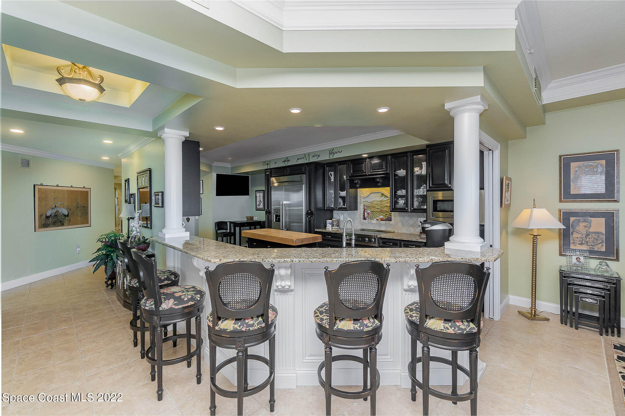 21 Riverside Drive, Unit 702 Cocoa, FL 32922 - Photo 12 of 53 a kitchen with a table and chairs