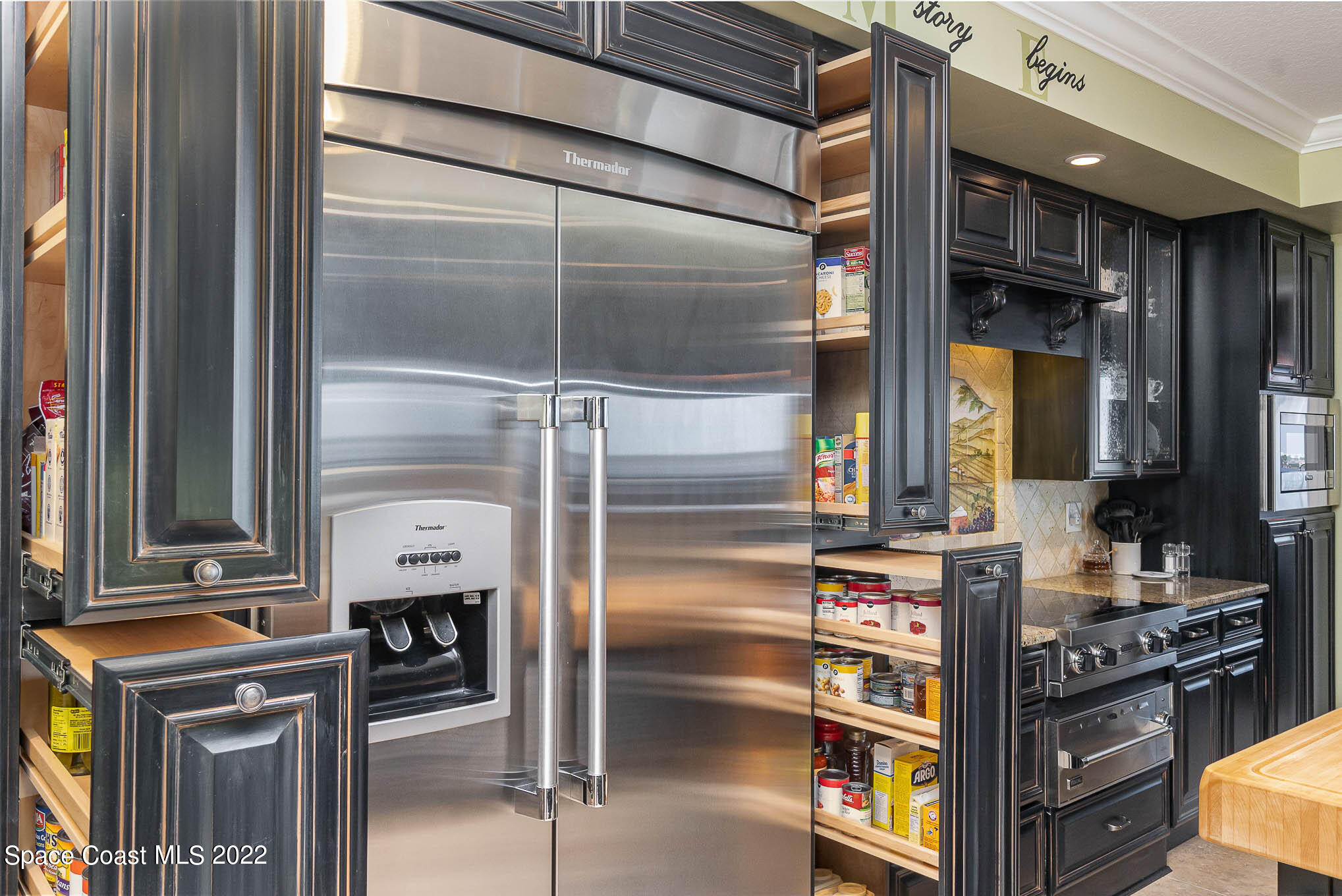 21 Riverside Drive, Unit 702 Cocoa, FL 32922 - Photo 15 of 53 a kitchen with stainless steel appliances granite countertop a refrigerator and a stove