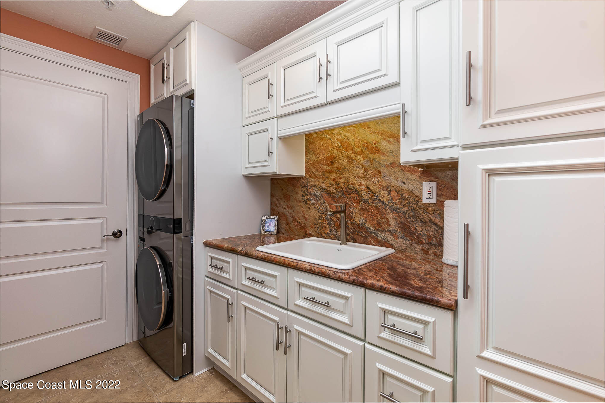 21 Riverside Drive, Unit 702 Cocoa, FL 32922 - Photo 33 of 53 a bathroom with a sink and a mirror