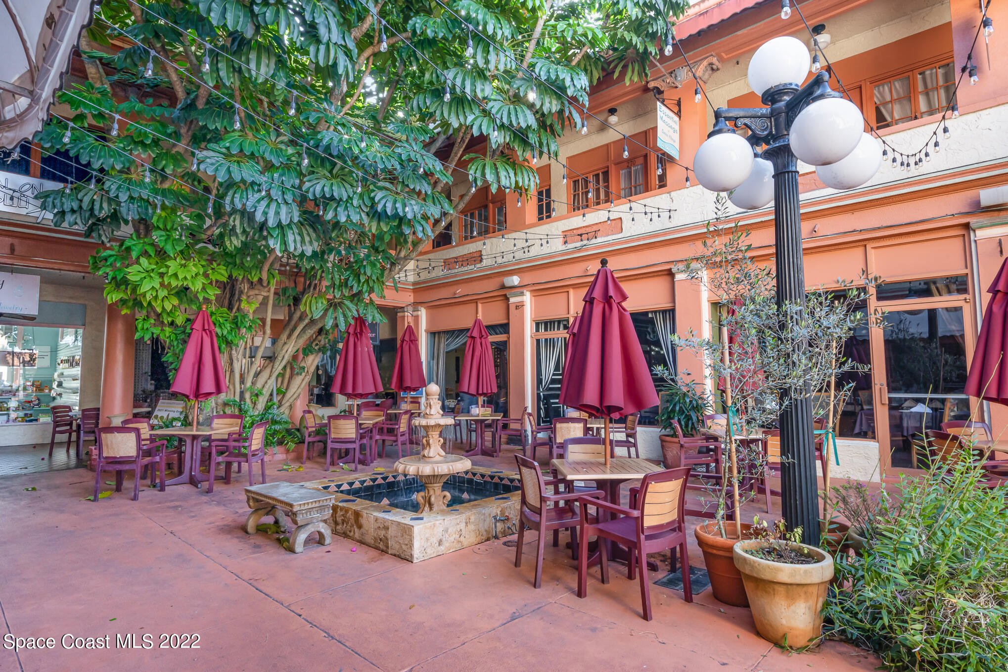 21 Riverside Drive, Unit 702 Cocoa, FL 32922 - Photo 46 of 53 a group of people sitting outside of a building