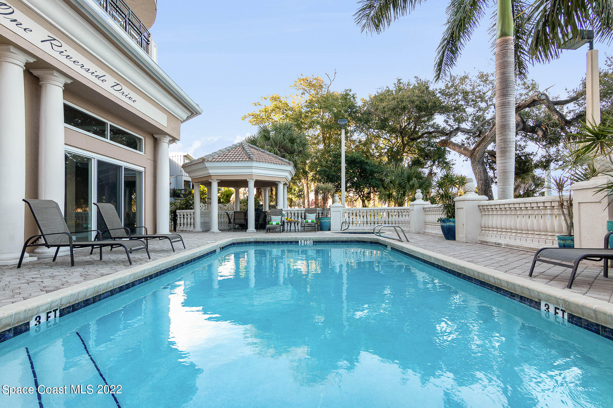 21 Riverside Drive, Unit 702 Cocoa, FL 32922 - Photo 7 of 53 a view of a house with swimming pool and sitting area