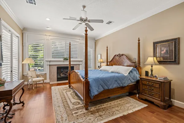 a bedroom with a bed and a fireplace