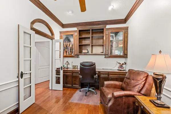 a work room with furniture and wooden floor