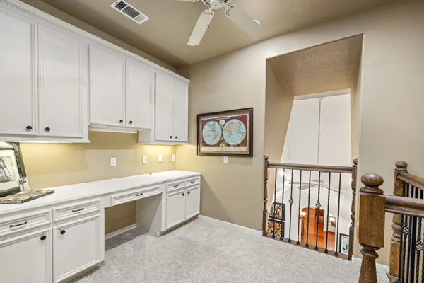 a kitchen with stainless steel appliances sink cabinets and a window