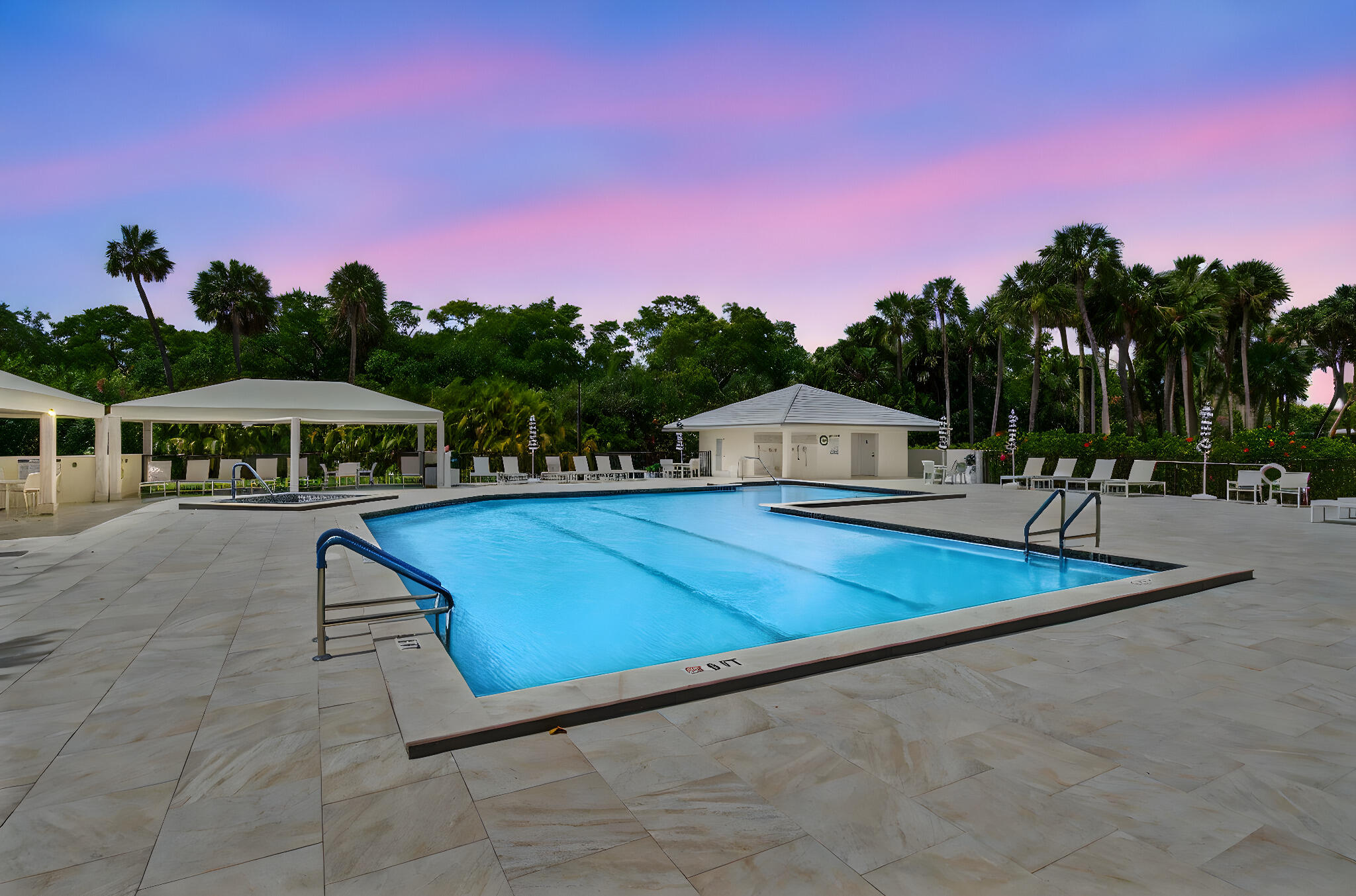 a view of outdoor space with swimming pool and trees in the background