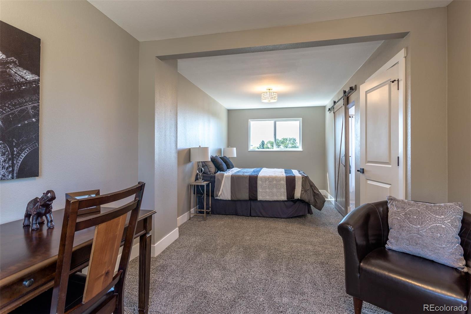 4465 South Eagle Circle Aurora, CO 80015 - Photo 13 of 26 a bedroom with furniture and a window