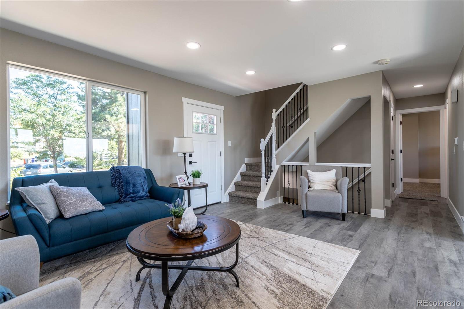 4465 South Eagle Circle Aurora, CO 80015 - Photo 3 of 26 a living room with furniture and a wooden floor