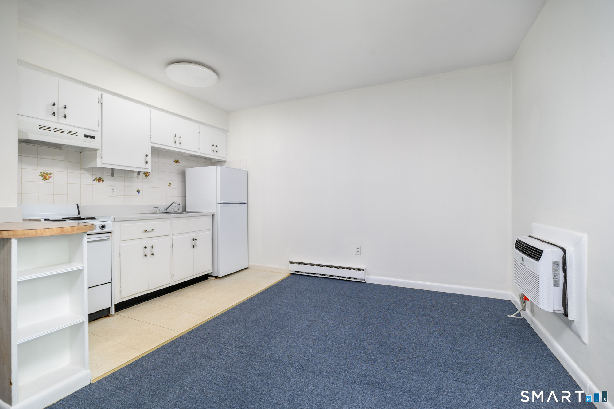 445 Hope Street, Unit 2 Stamford, CT 06906 - Photo 3 of 9 a view of a kitchen with cabinets and outdoor view
