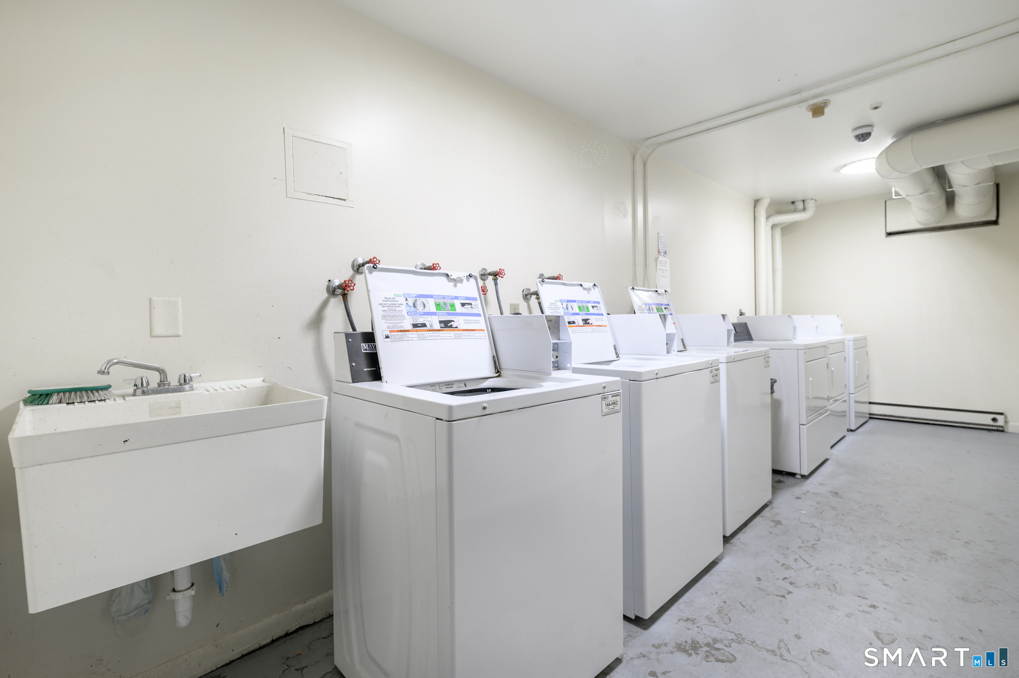 445 Hope Street, Unit 2 Stamford, CT 06906 - Photo 8 of 9 a utility room with dryer and washer