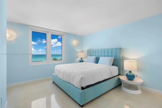 a bedroom with a bed lamp and window