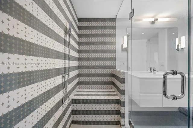 a bathroom with a tub and shower