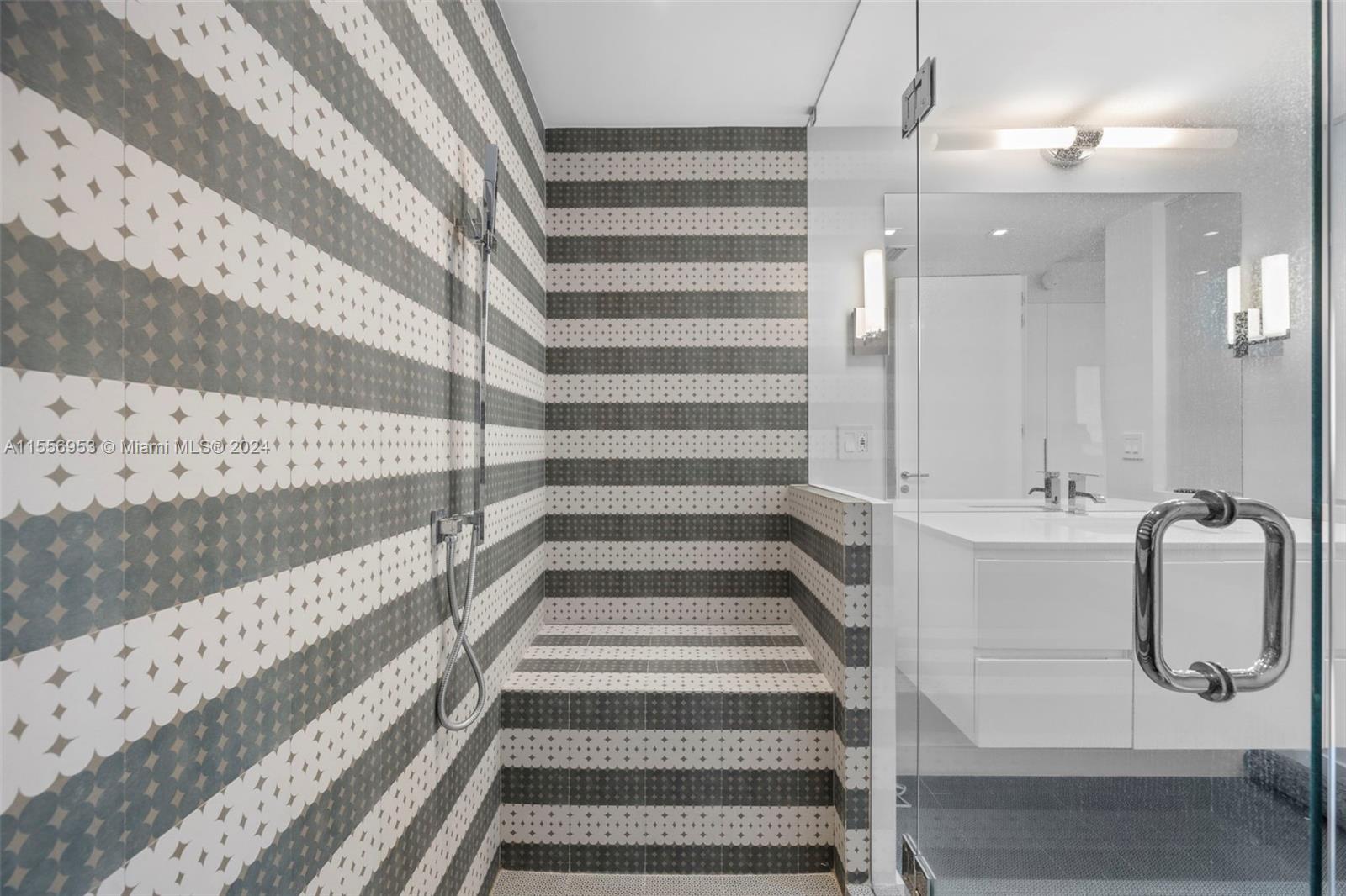 2301 Collins Avenue, Unit 410 Miami Beach, FL 33139 - Photo 28 of 42 a bathroom with a tub and shower