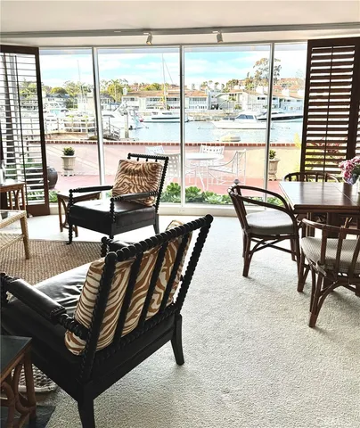 a living room with furniture a rug and a fireplace