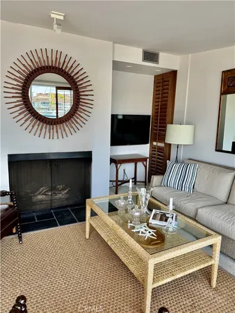 a living room with furniture pool table and projector