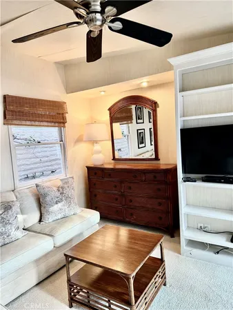 a view of a hallway with a living room