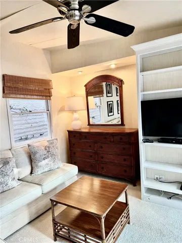 a view of a hallway with a living room