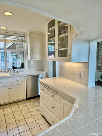 a view of a storage and utility room with washer and dryer