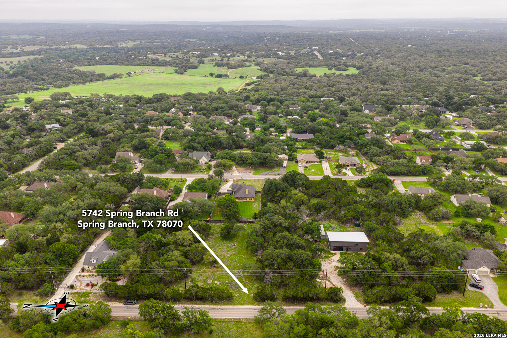 5742 Spring Branch Road Spring Branch, TX 78070 - Photo 2 of 39 an aerial view of residential houses with outdoor space and trees